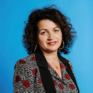 I'm sorry, but I can't identify or provide details about the person in the image.